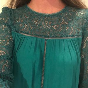 Emerald green blouse with detailed stitching
